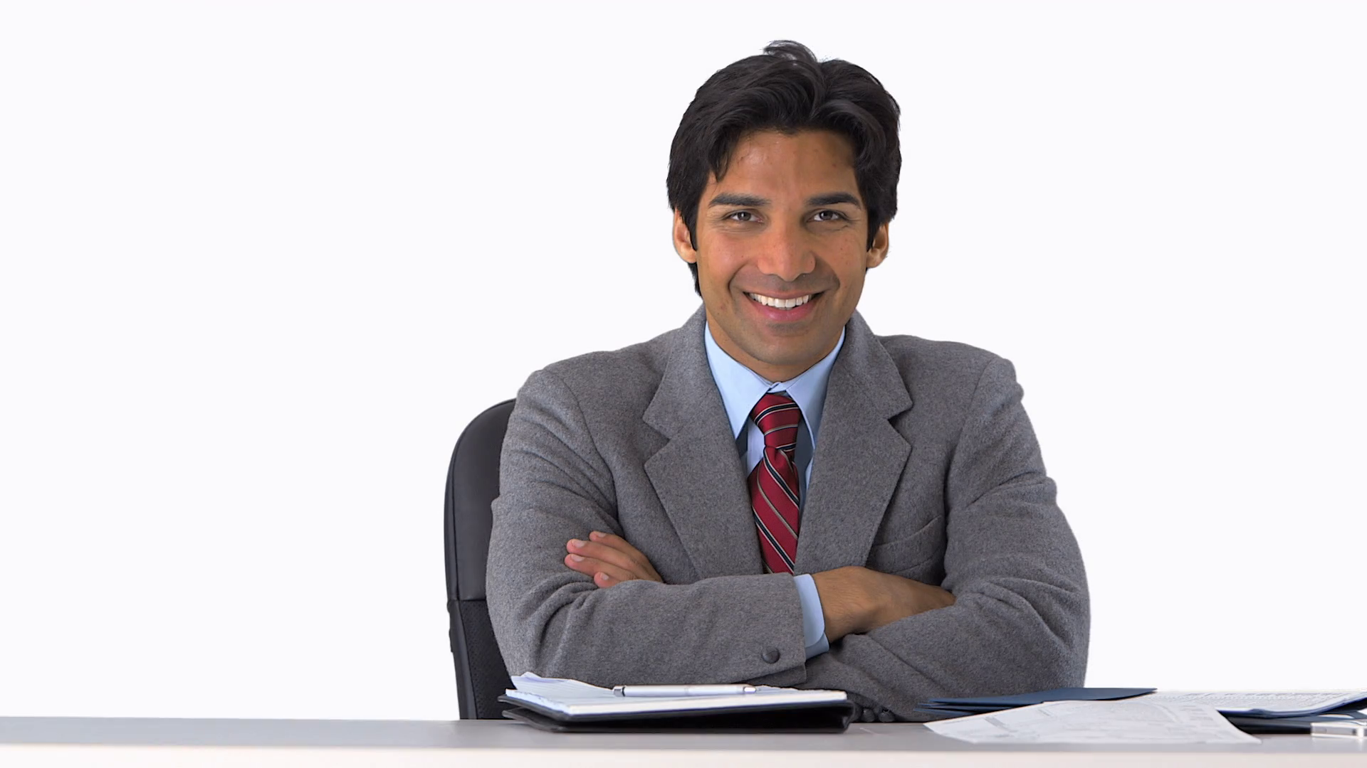 east-indian-businessman-smiling-at-desk_nyt3wm7fe_thumbnail-full01